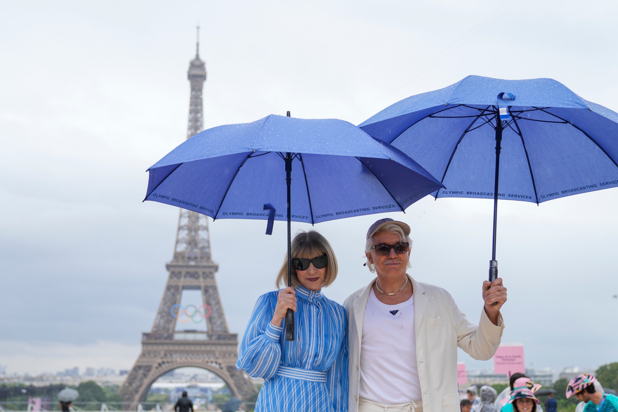 Anna Wintour, Vogue editor, and director Baz Luhrmann arrive in Paris, France, before the opening ceremony of the 2024 Summer Olympics, Friday, July 26, 2024. (AP Photo/Natacha Pisarenko)